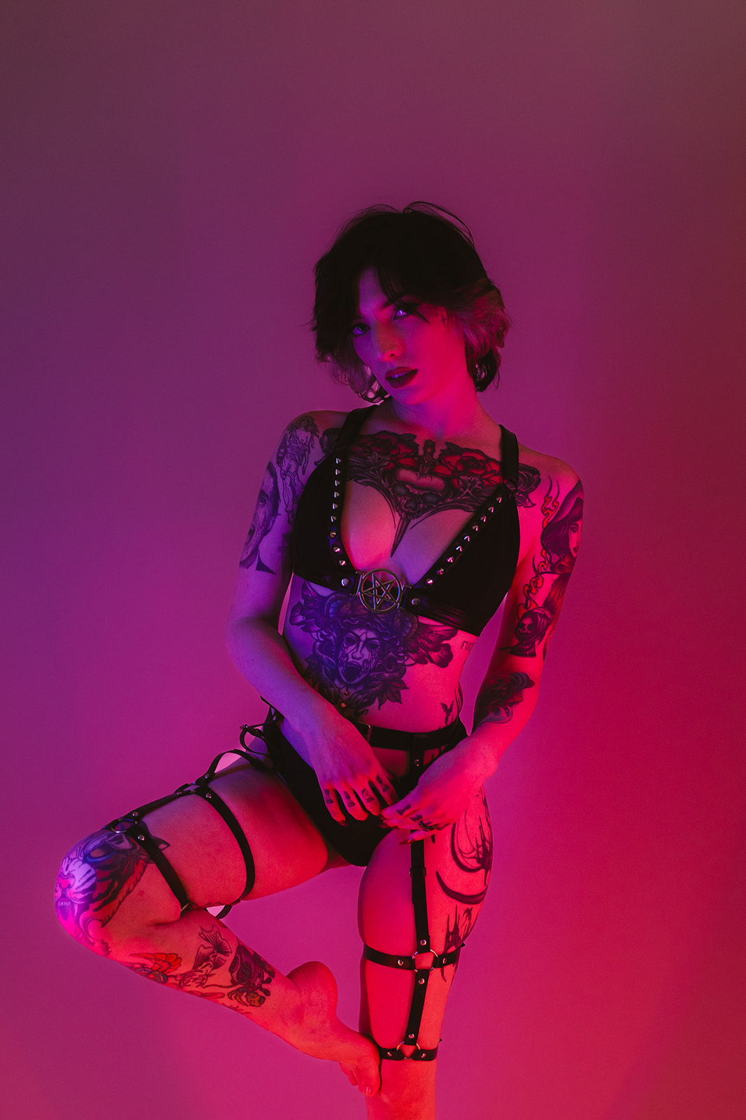 A girl posing for boudoir photos, showing off boudoir photoshoot ideas