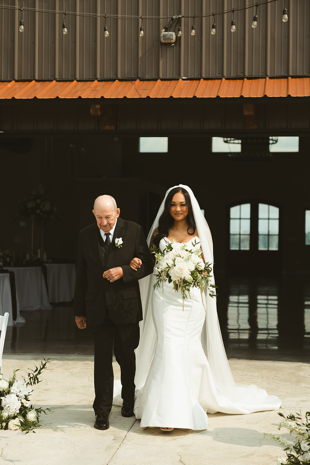 Bride and her grandfather walking down the aisle