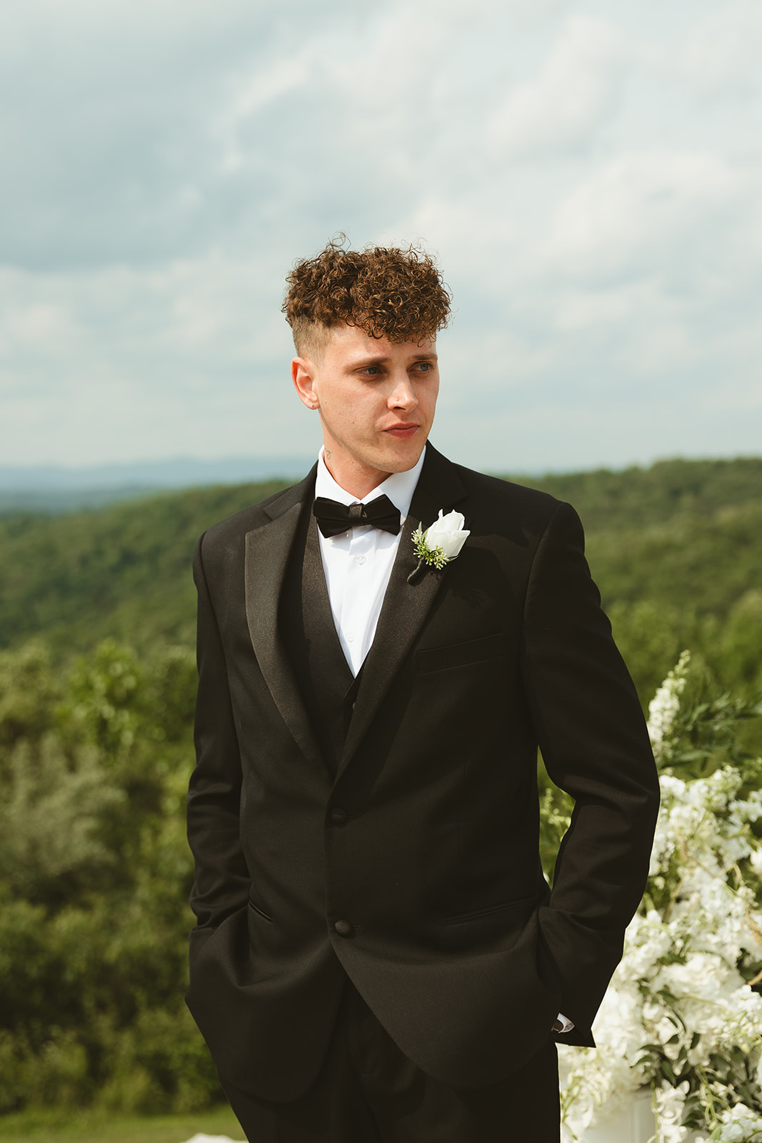Groom crying while bride walks down the aisle