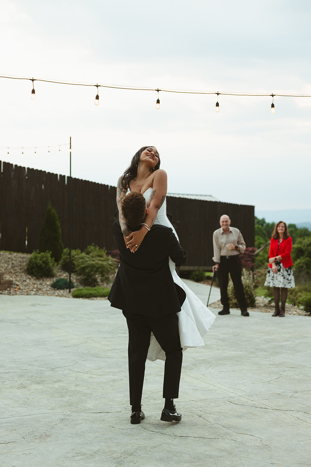 Bride and groom choreographed first dance with groom lifting bride up