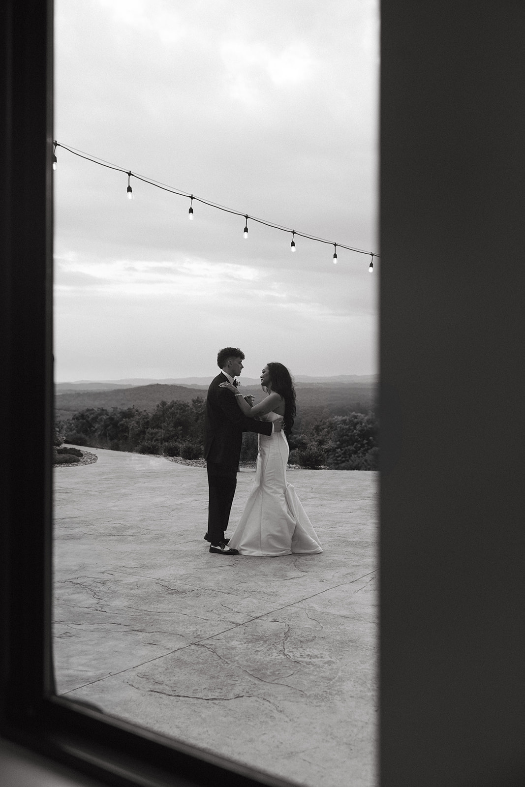 Candid wedding photo of bride and groom sharing a private last dance