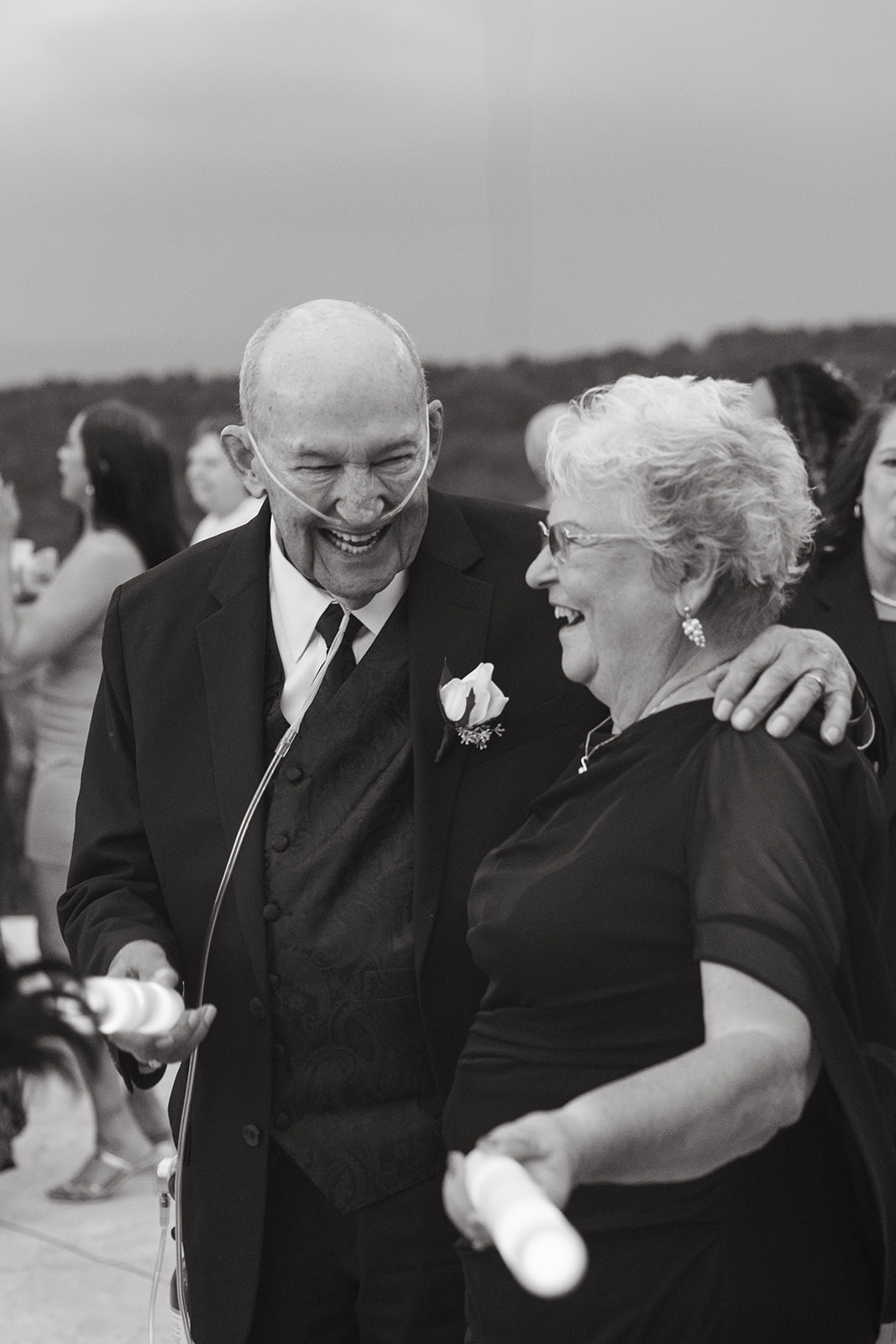 Bride's grandparents laughing in a candid wedding photo