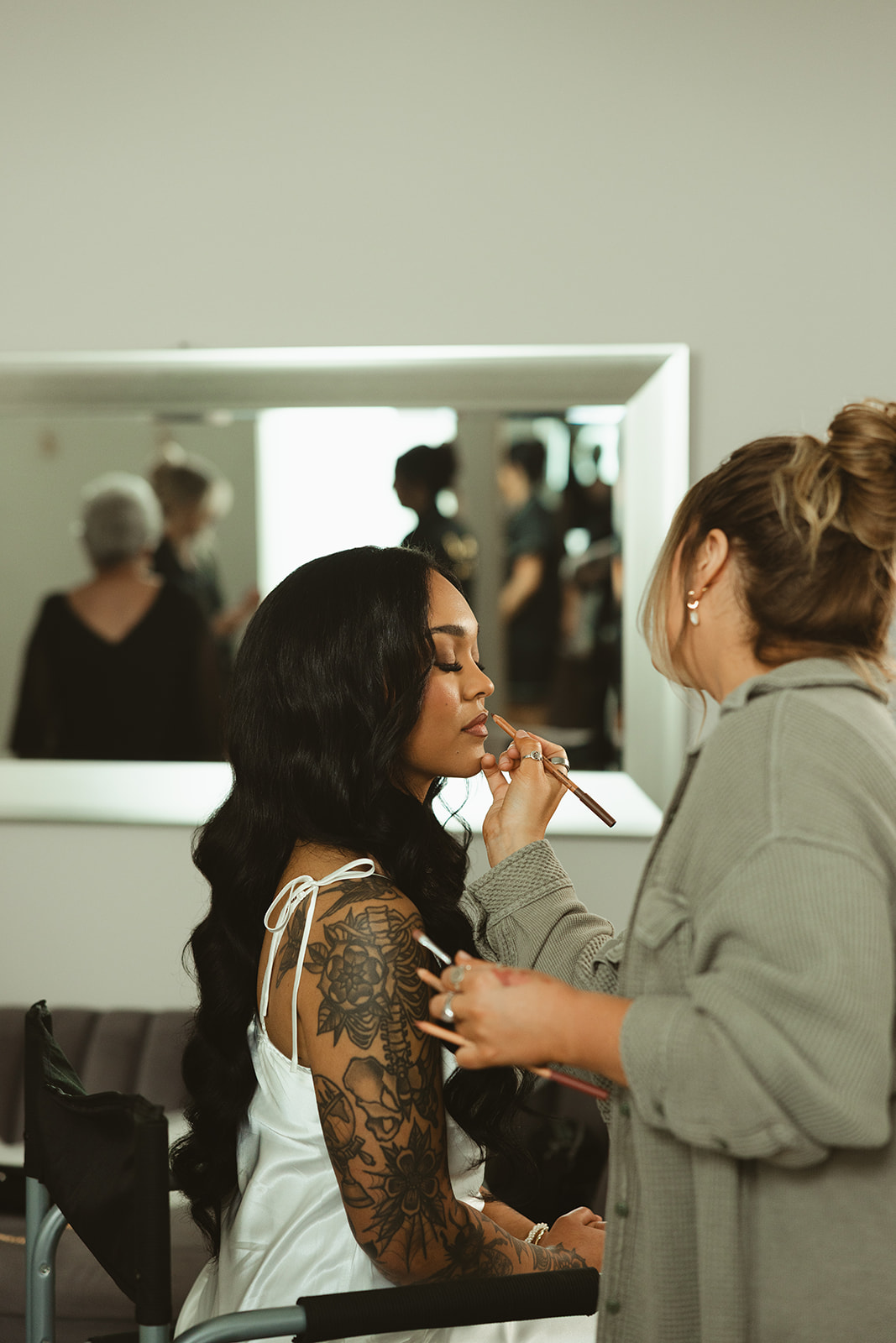 Wedding getting ready photo of bride having lipstick put on