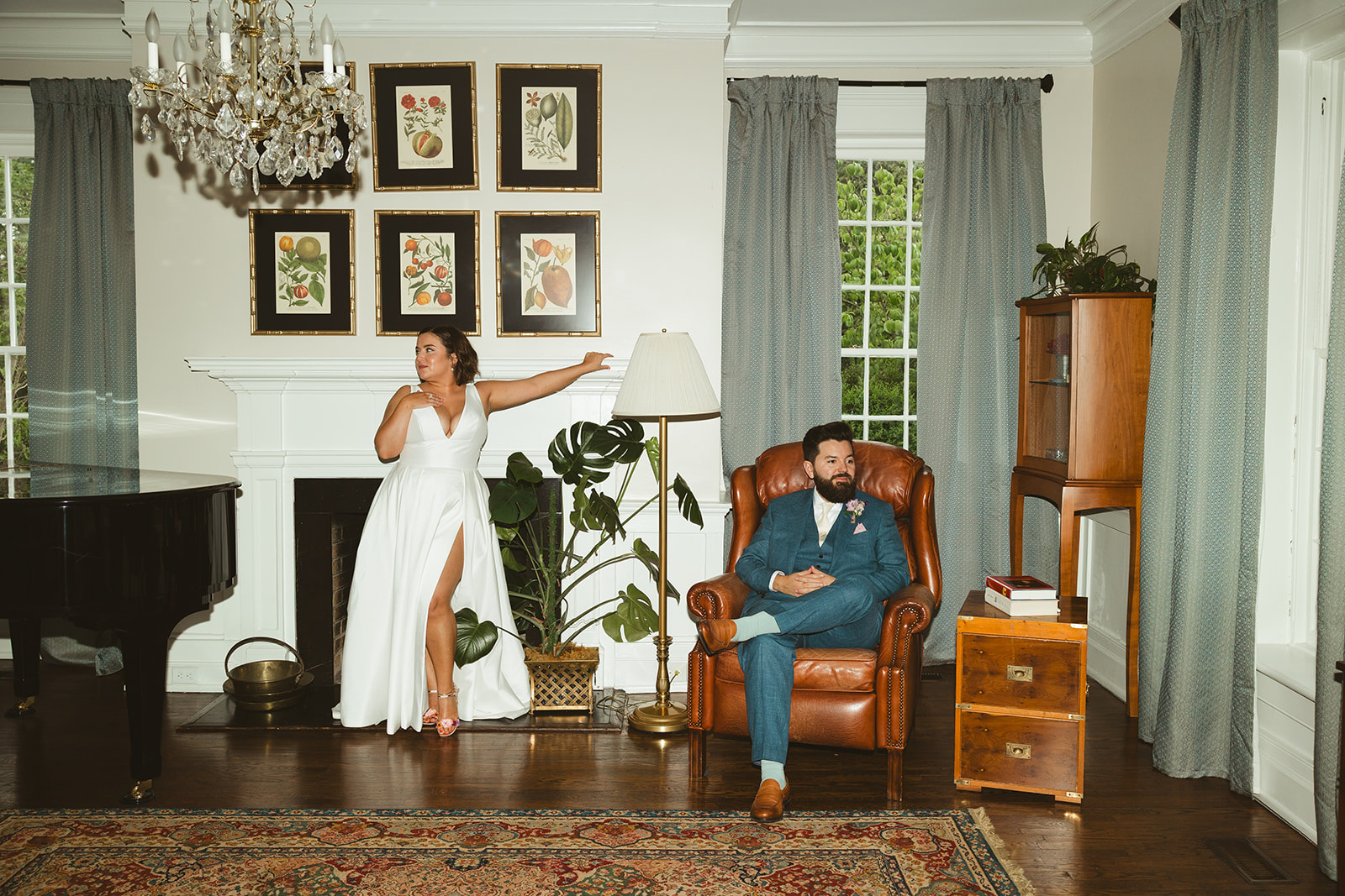 An editorial wedding photo of bride and groom posing inside of their venue, Maple Grove Estate