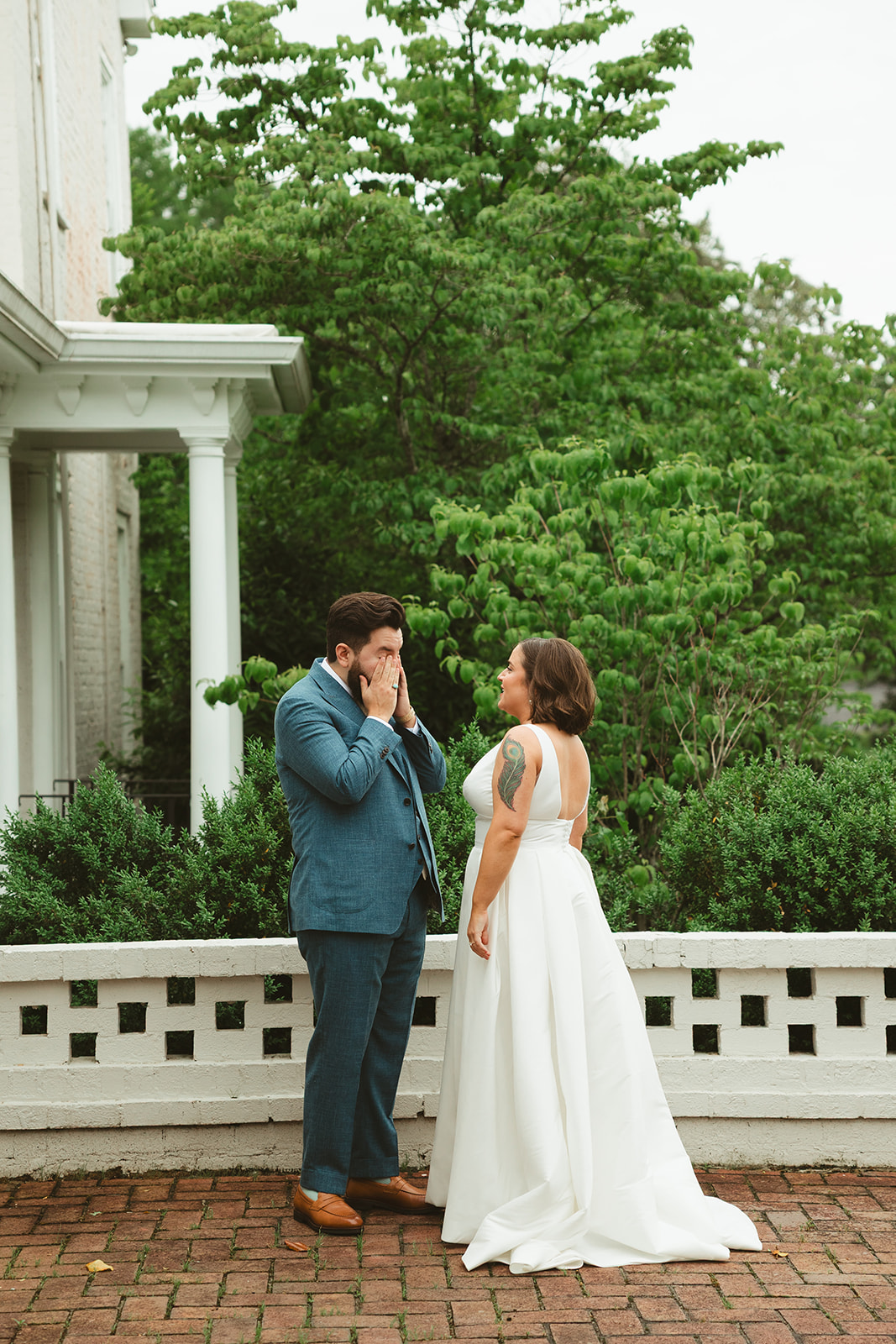 A groom crying during first look wedding photos