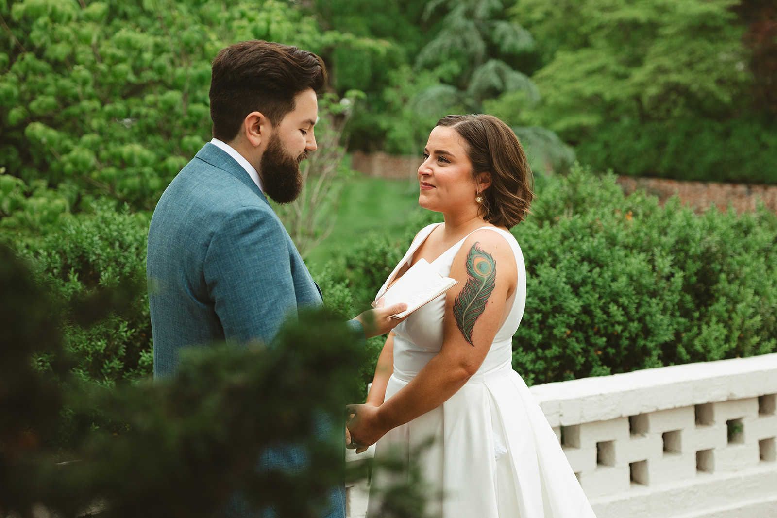 A groom reading private vows to his bride