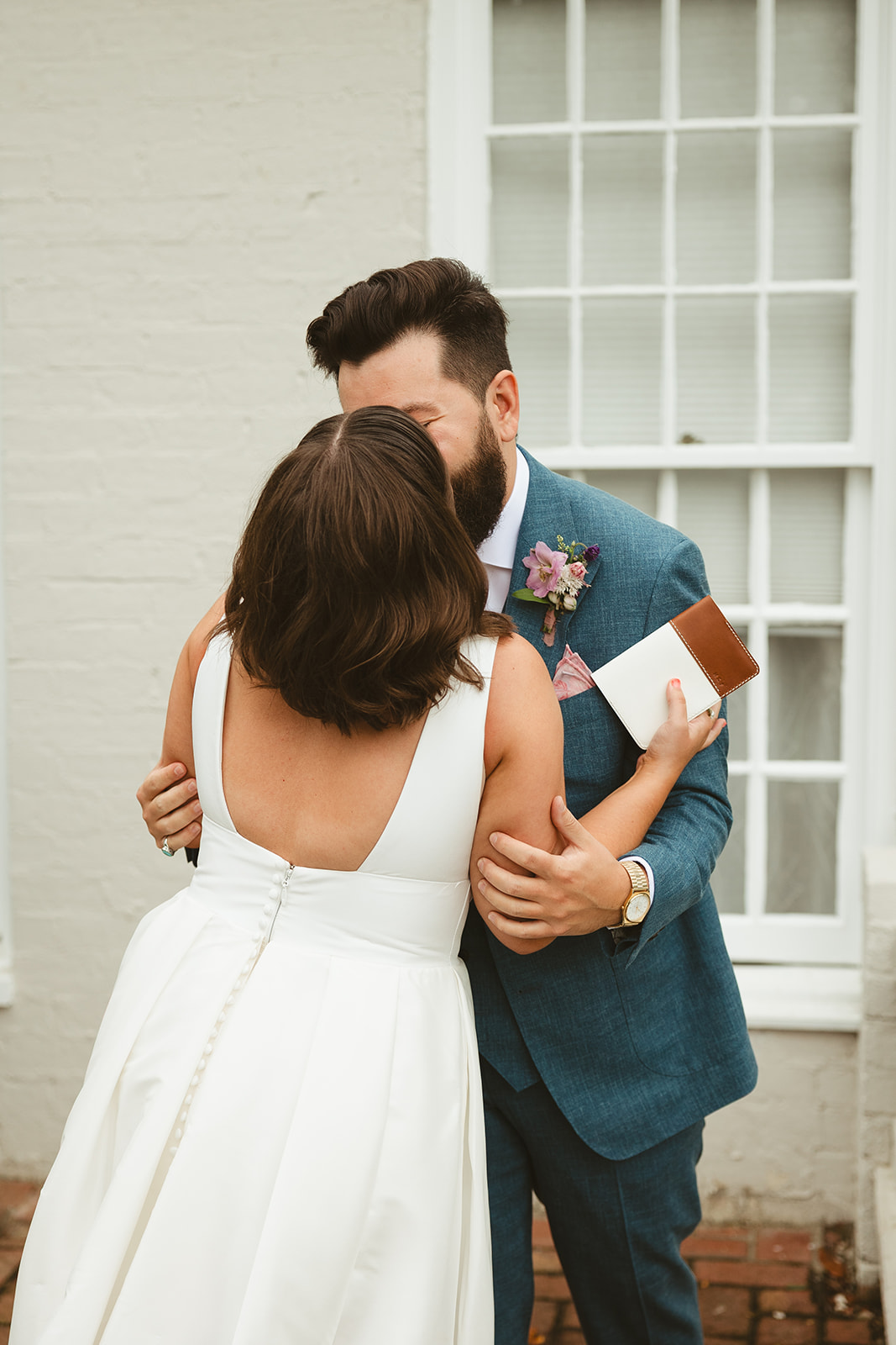 A bride and groom kissing after their private first look