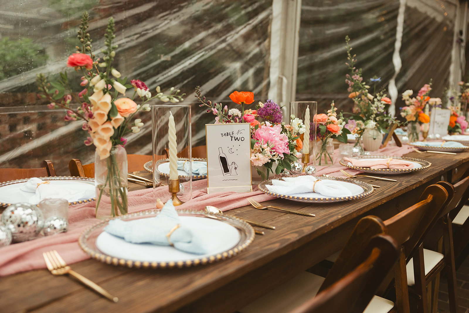 A wedding table setup that's perfect for colorful wedding ideas, with colorful table decor and disco balls