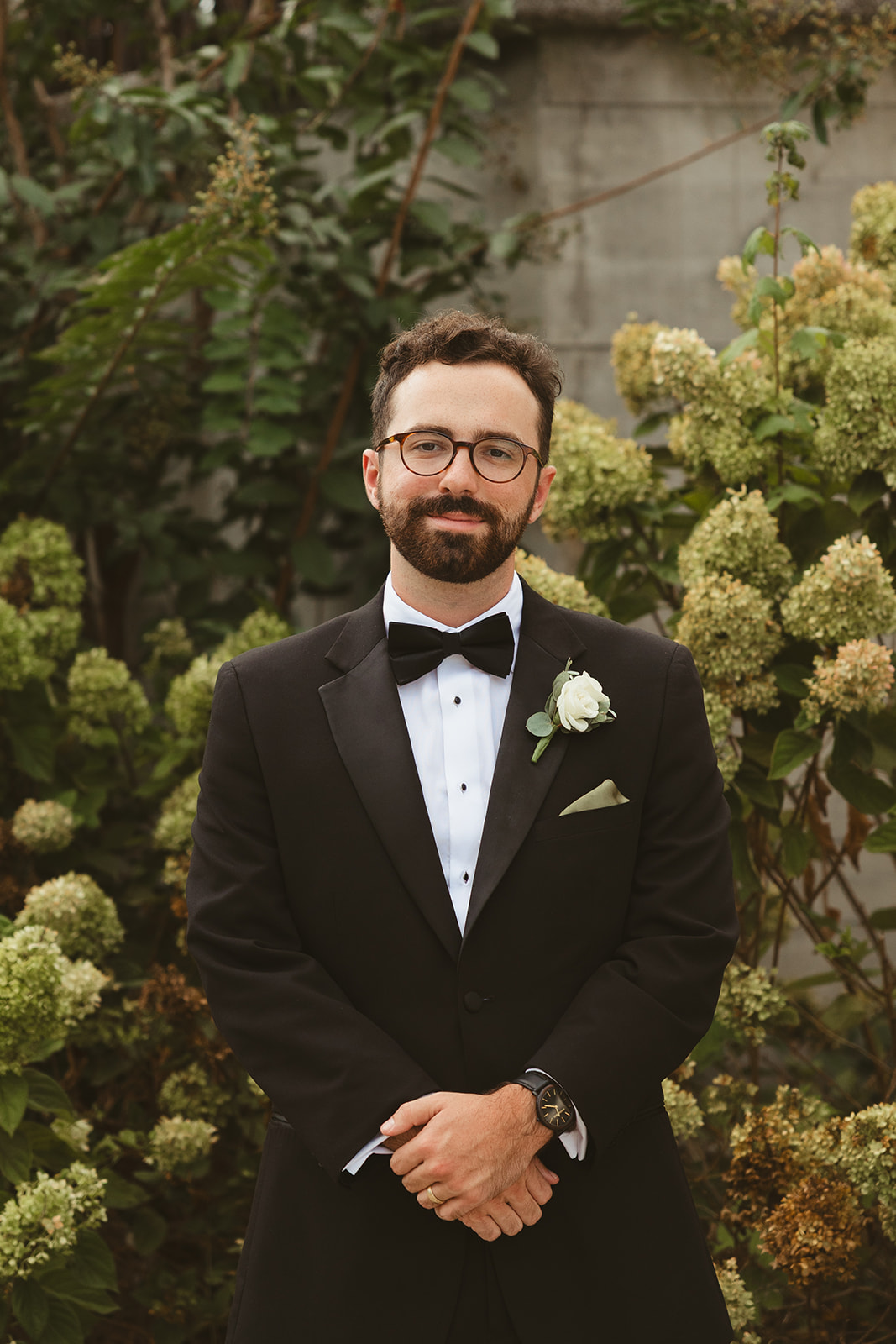 A candid photo of a groom captured through documentary style wedding photography
