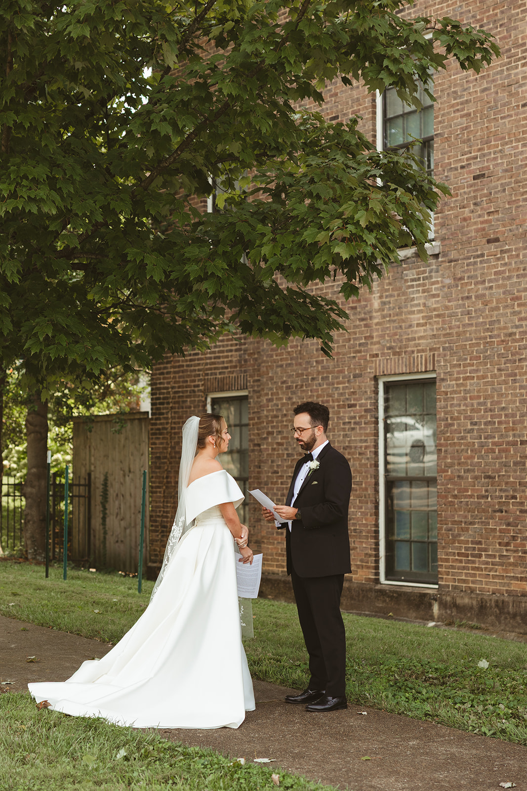 A couple reading private vows, captured through documentary style wedding photography
