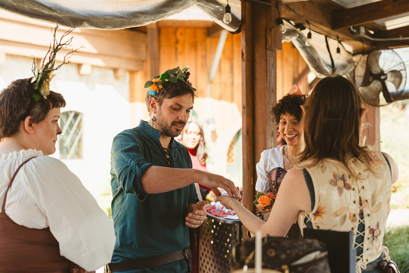 Wedding guests at a renaissance wedding on a scavenger hunt