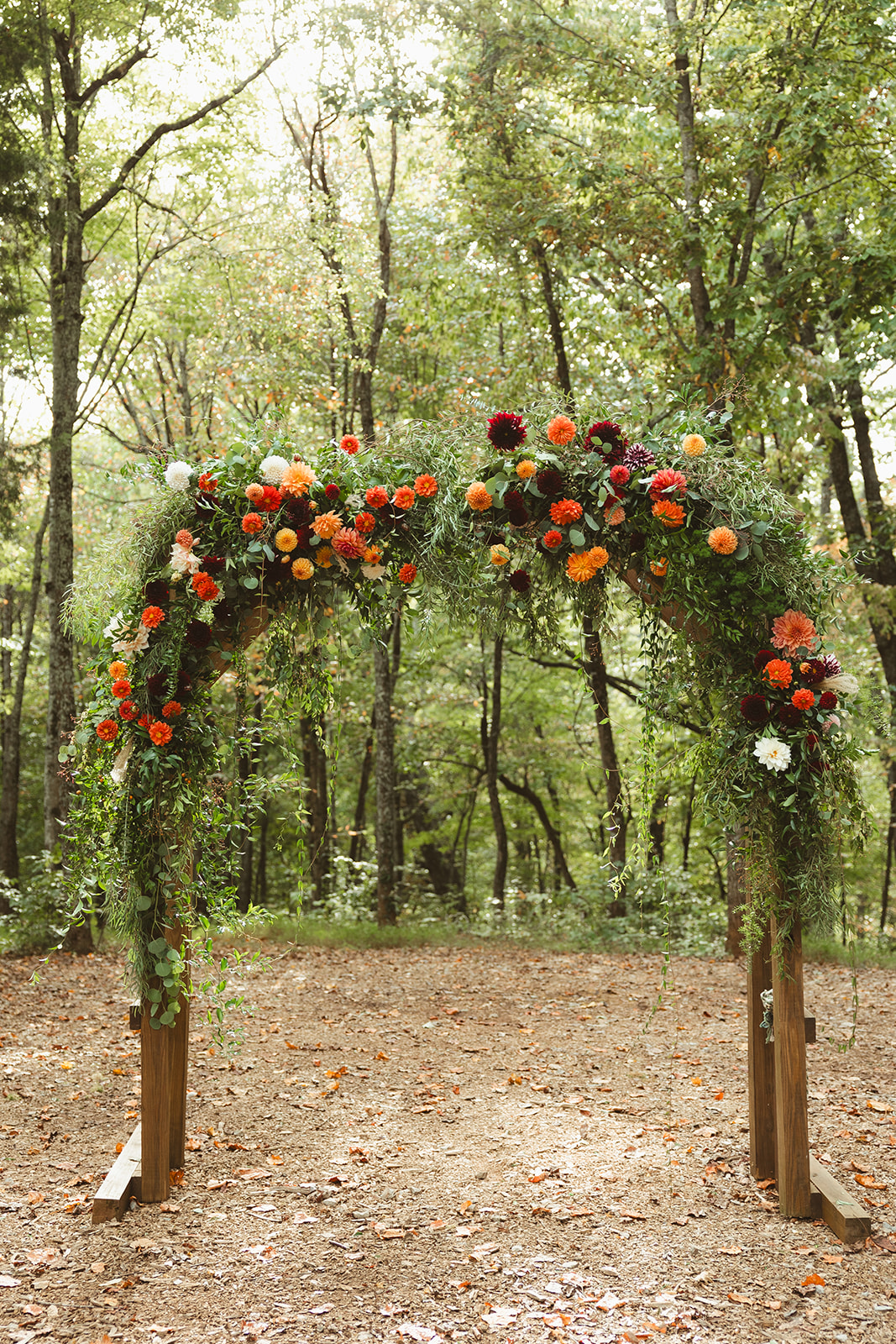 A wedding arch in the woods at Ancient Lore Village
