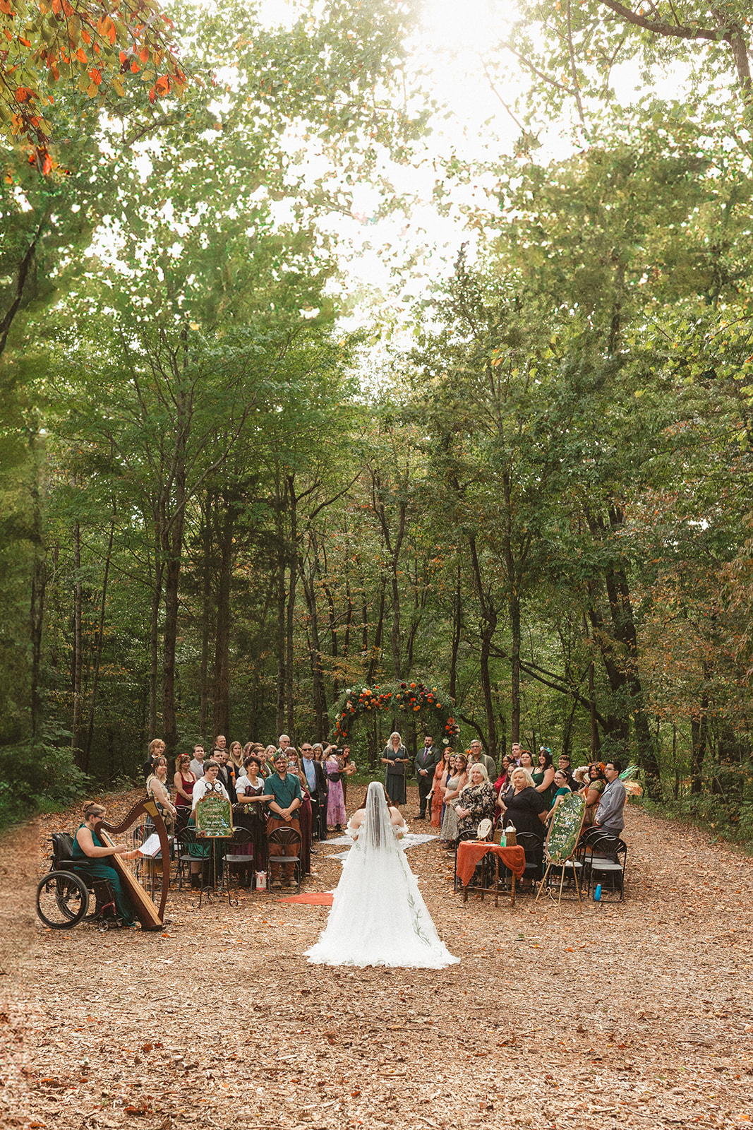 A bride walking down the aisle at her Ancient Lore Village wedding ceremony