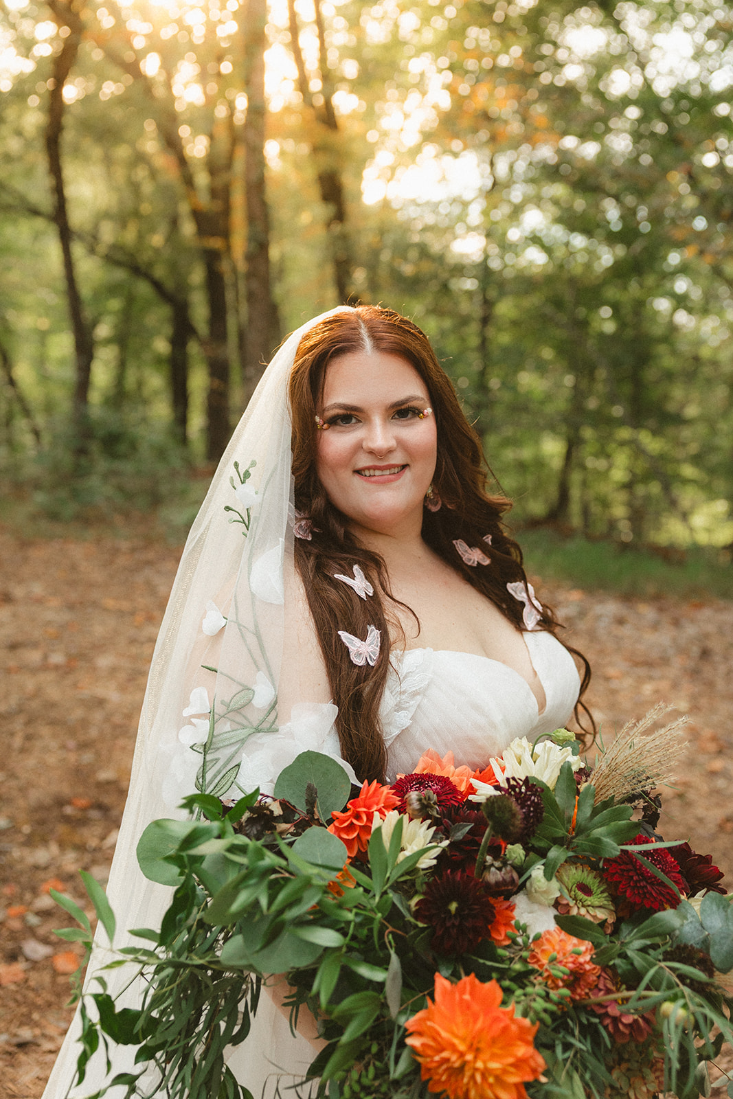A bride posing for portraits from her Ancient Lore Village wedding