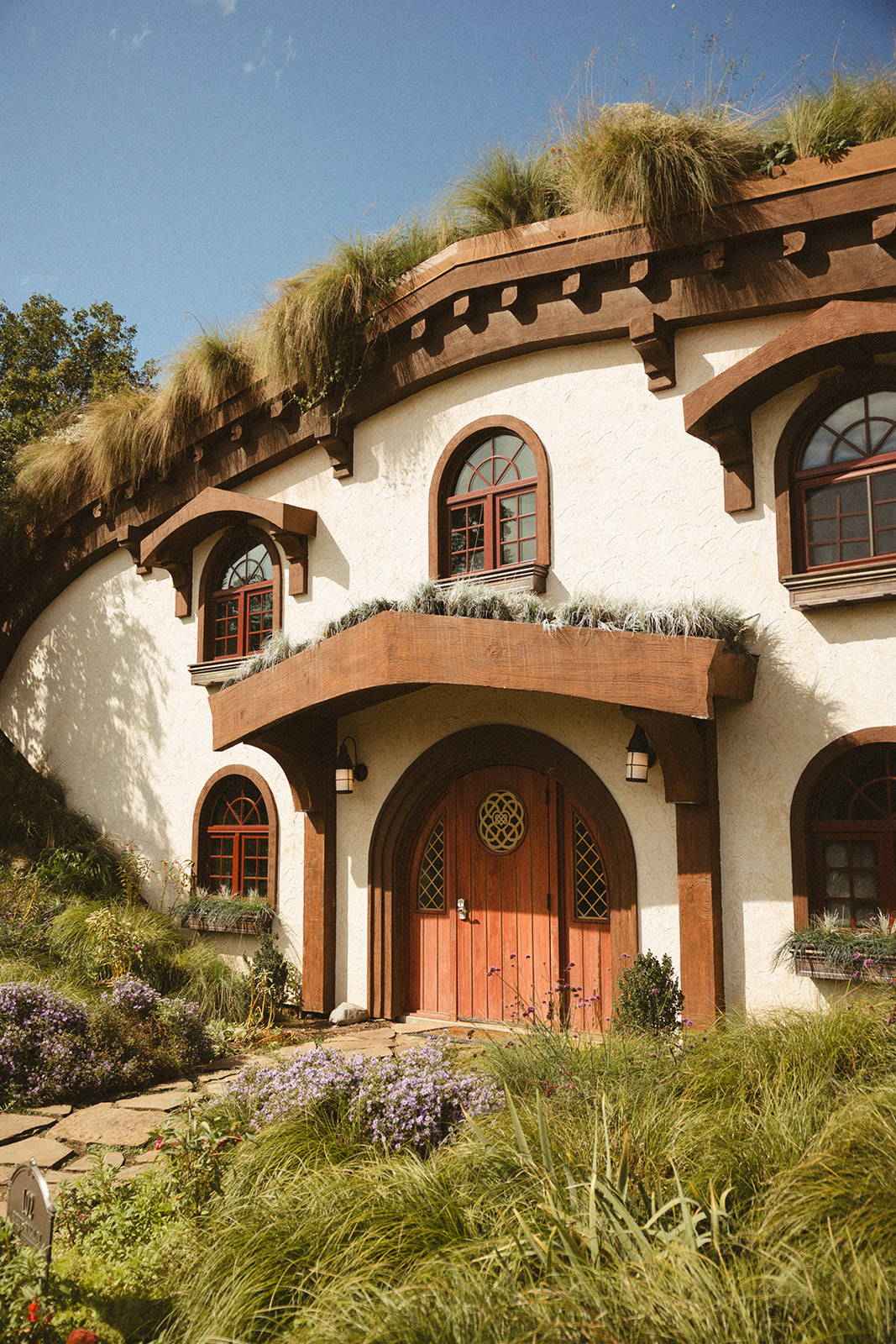 The outside of a hobbit house at Ancient Lore Village