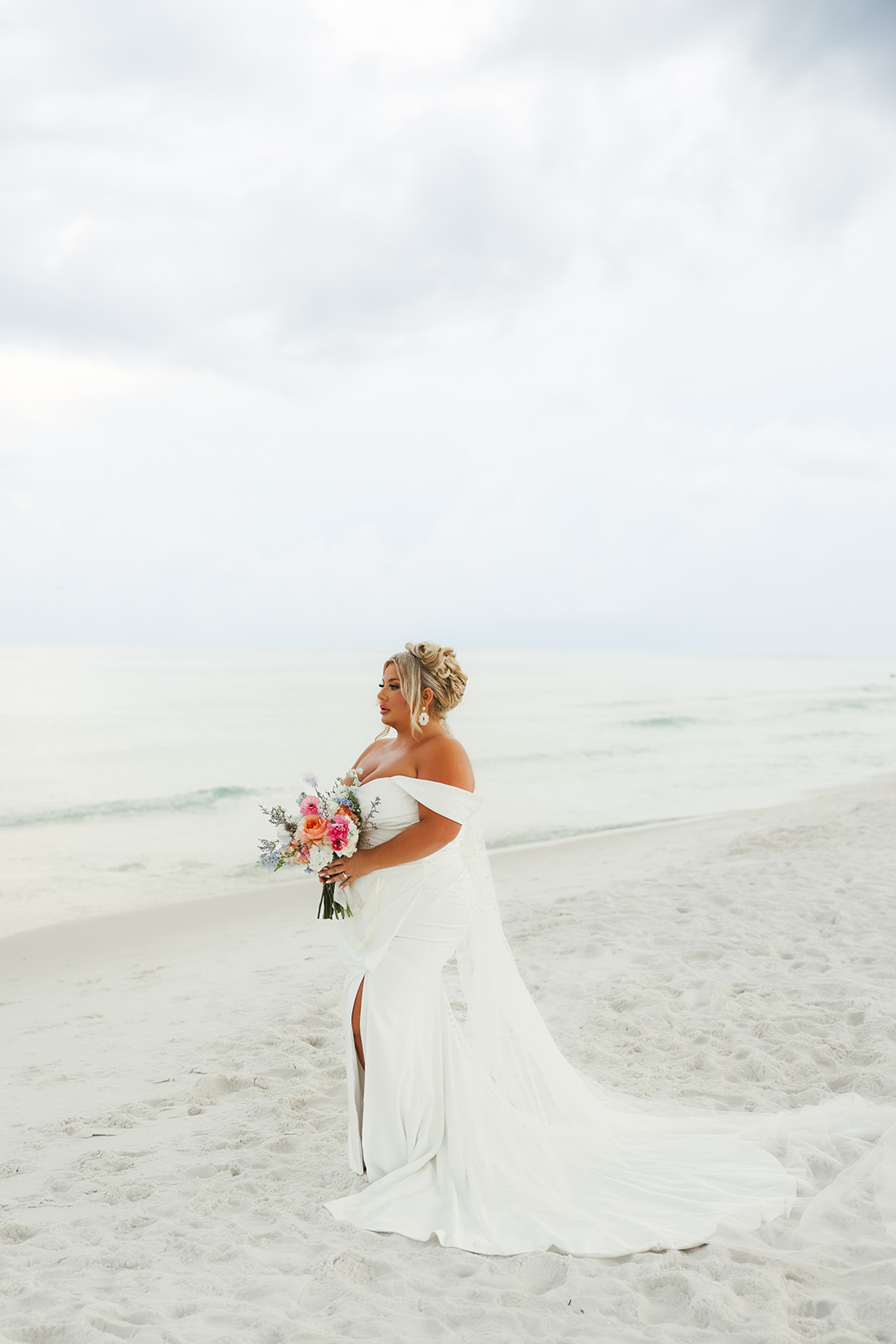 A bride's beach wedding dress on the beach in 30a