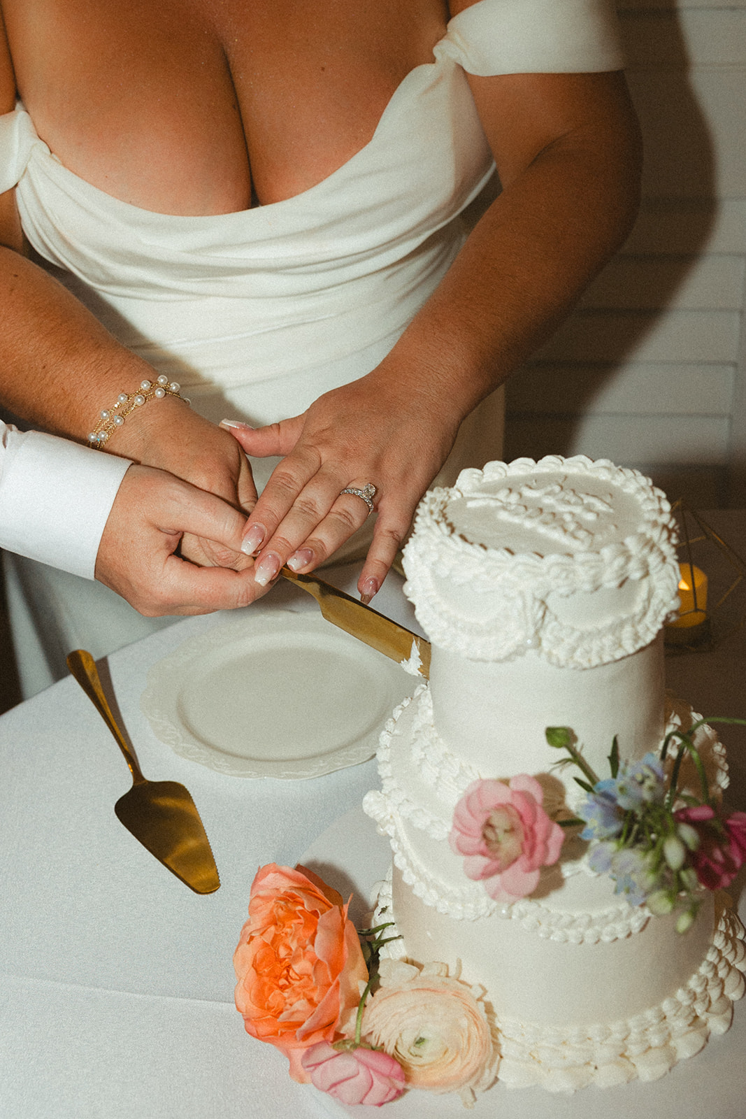 Two brides during their wedding cake cutting