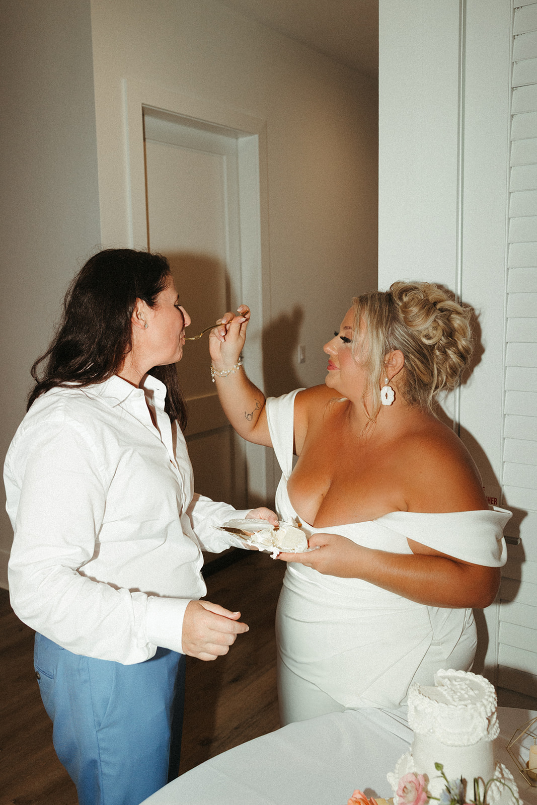Two brides during their wedding cake cutting