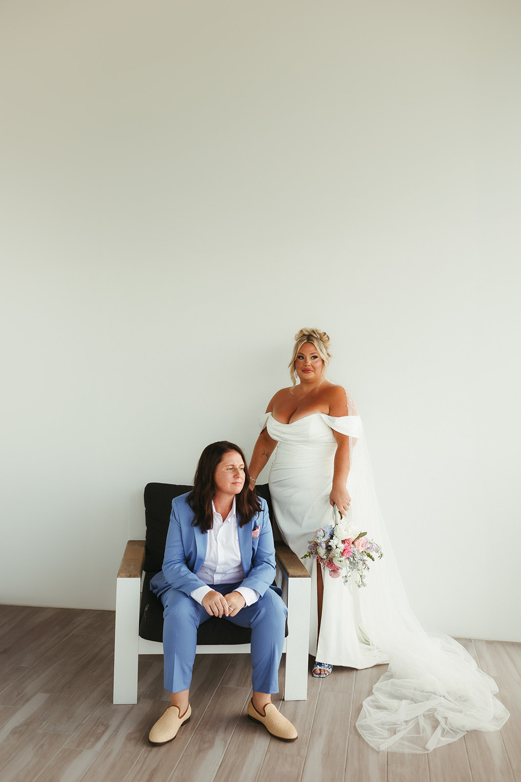 Two brides posing for Florida beach wedding photos