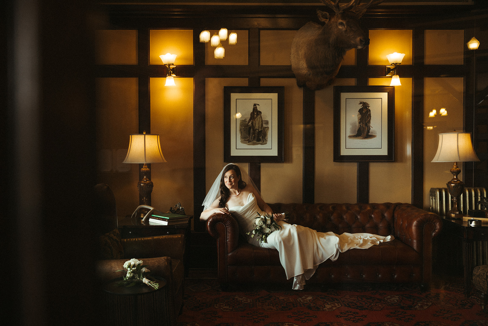 A bride on a couch inside of the sacajawea hotel
