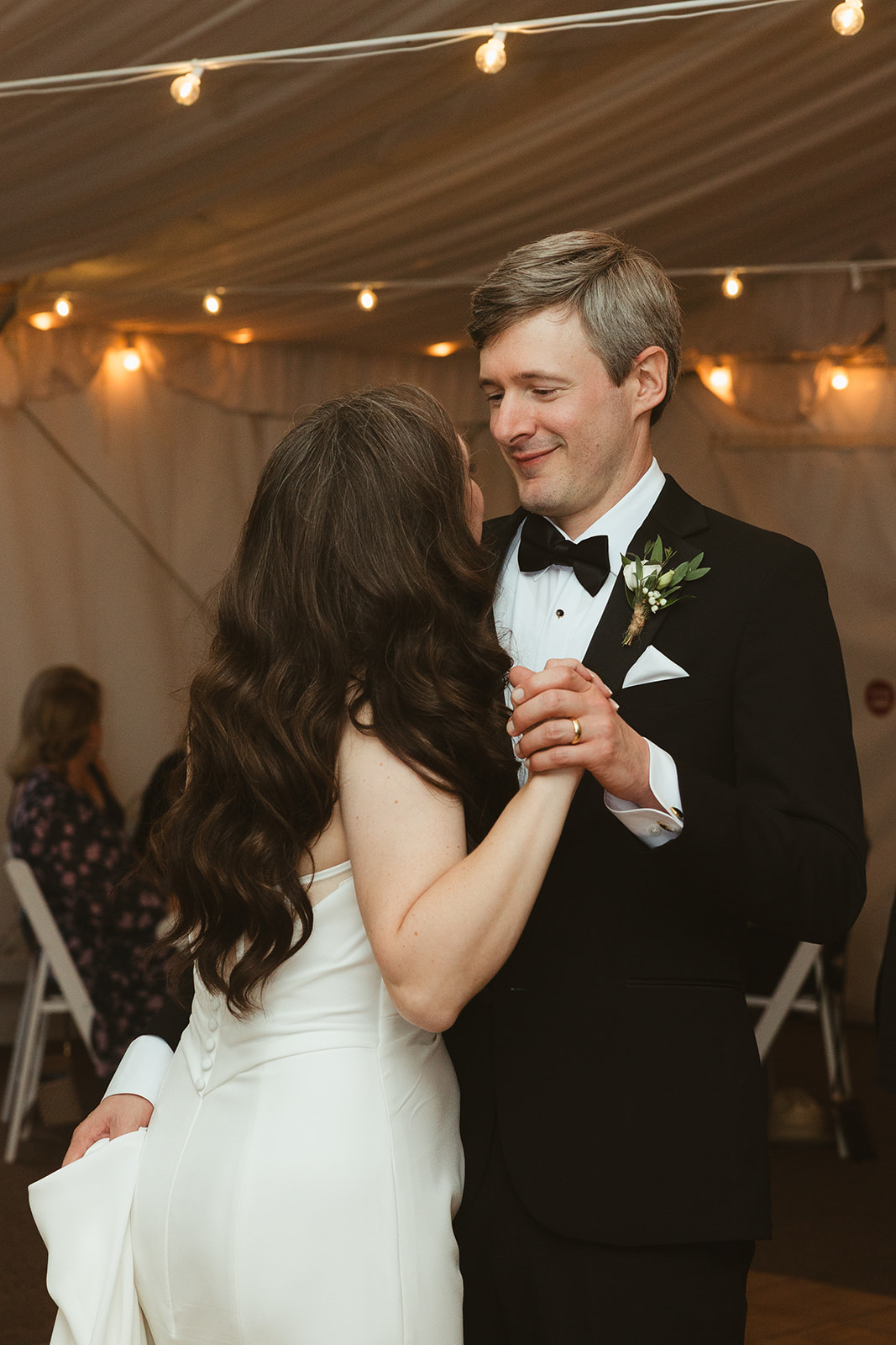 A bride and groom dancing at their wedding reception