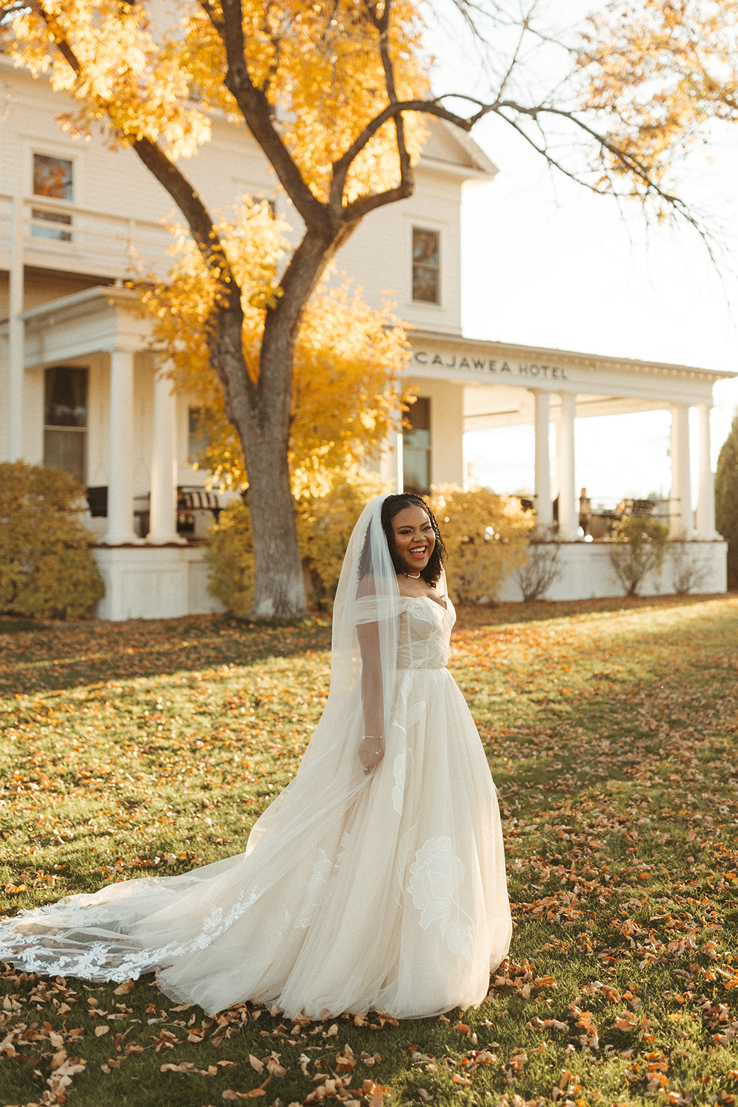 A bride standing in front of the Sacajawea Hotel