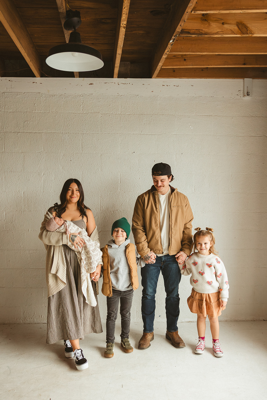 A family posing for studio family photos