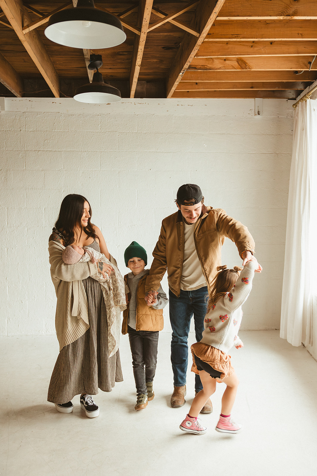 A family posing for studio family photos